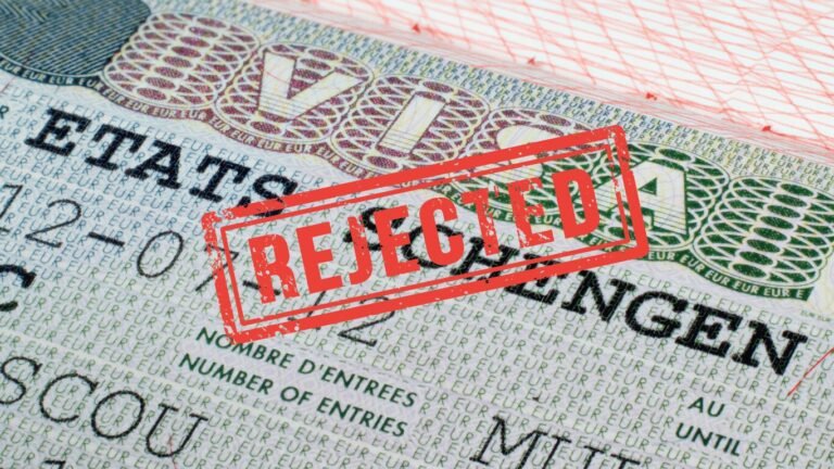 Schengen visa document stamped with ‘Rejected’ in red, symbolizing visa refusal