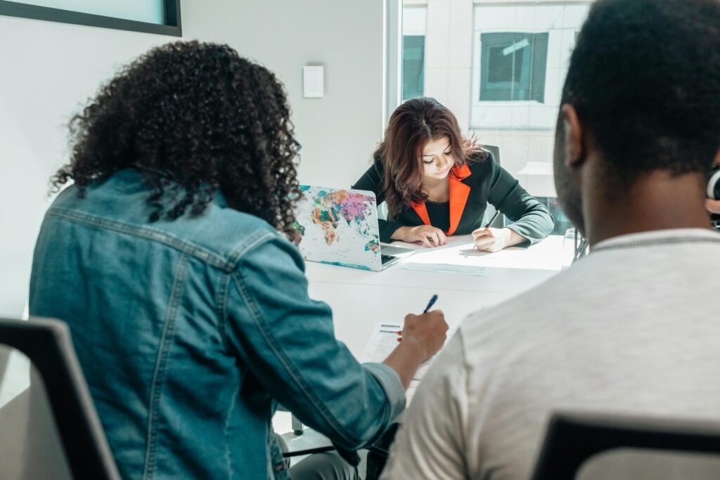A group filling out application documents