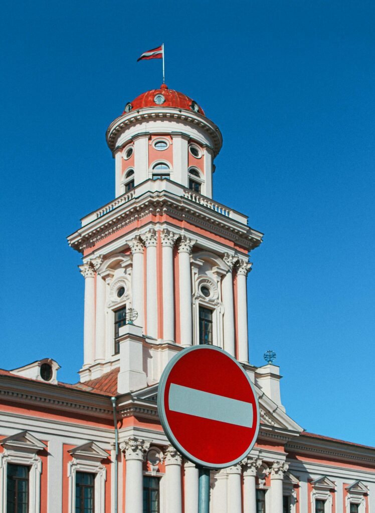 Low angle shot of Jelgava's historic building with clear blue skies.