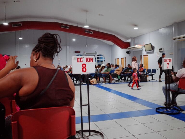 passengers seated at port of spain ferry terminal in trinidad and tobago