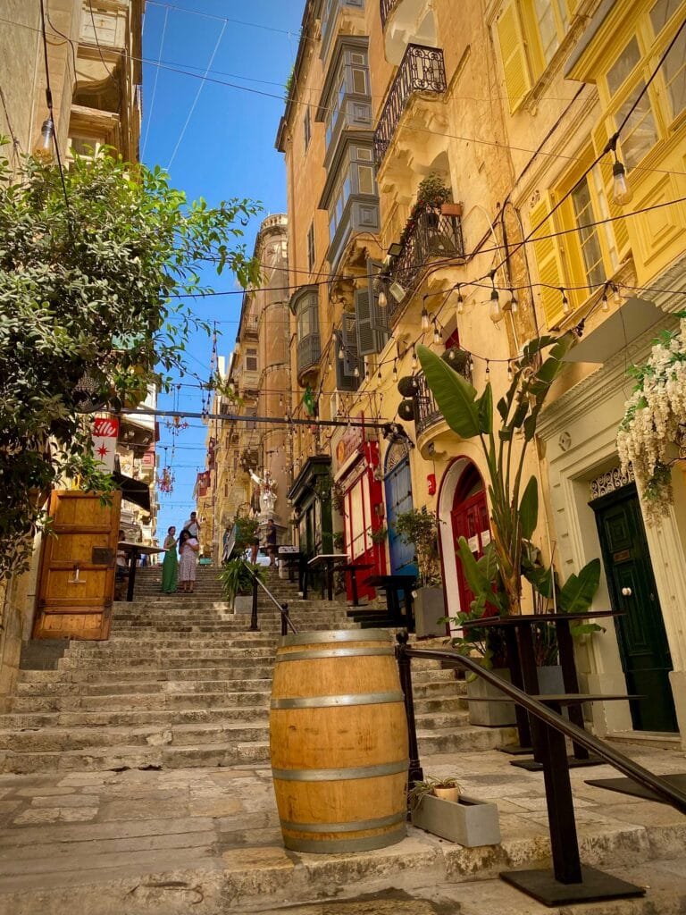 A street in Valletta, Malta with golden-colored buildings on a nice summers day