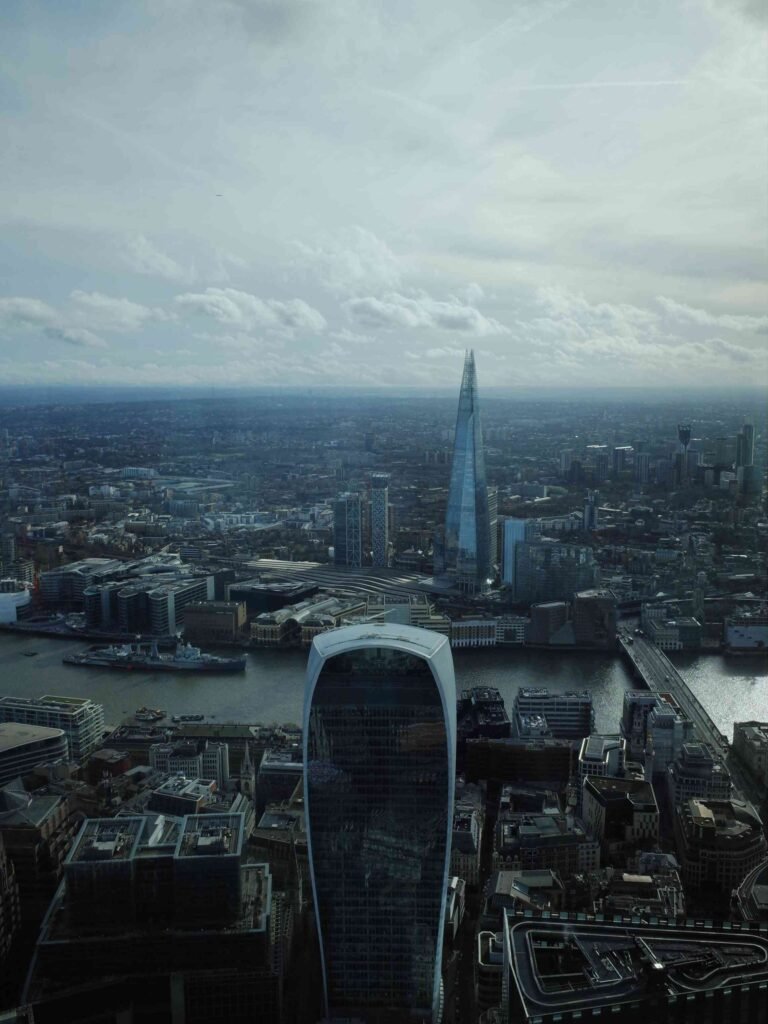 View from Horizon 22 showing the Walkie Talkie building in the foreground and The Shard rising across the River Thames.