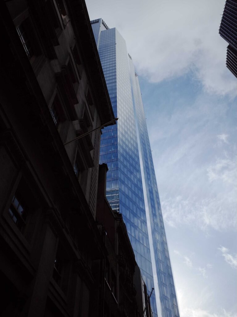 Looking up at 22 Bishopsgate in London, a glass skyscraper rising above surrounding buildings, home to the Horizon 22 viewing platform.