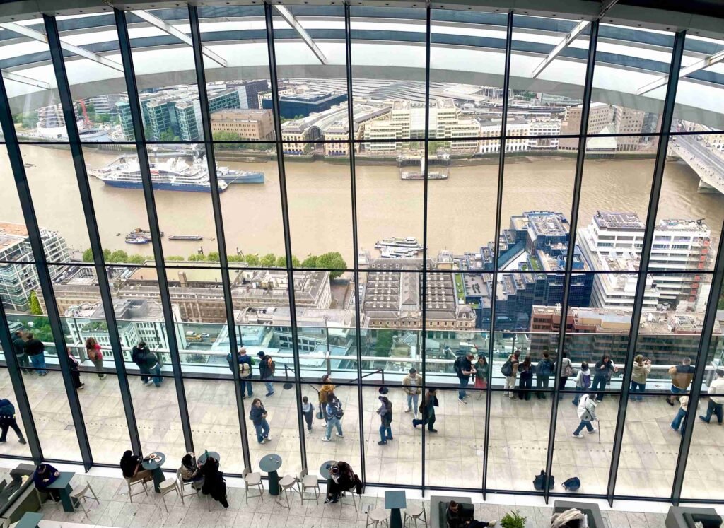 Visitors enjoying views of the River Thames from Sky Garden's observation deck